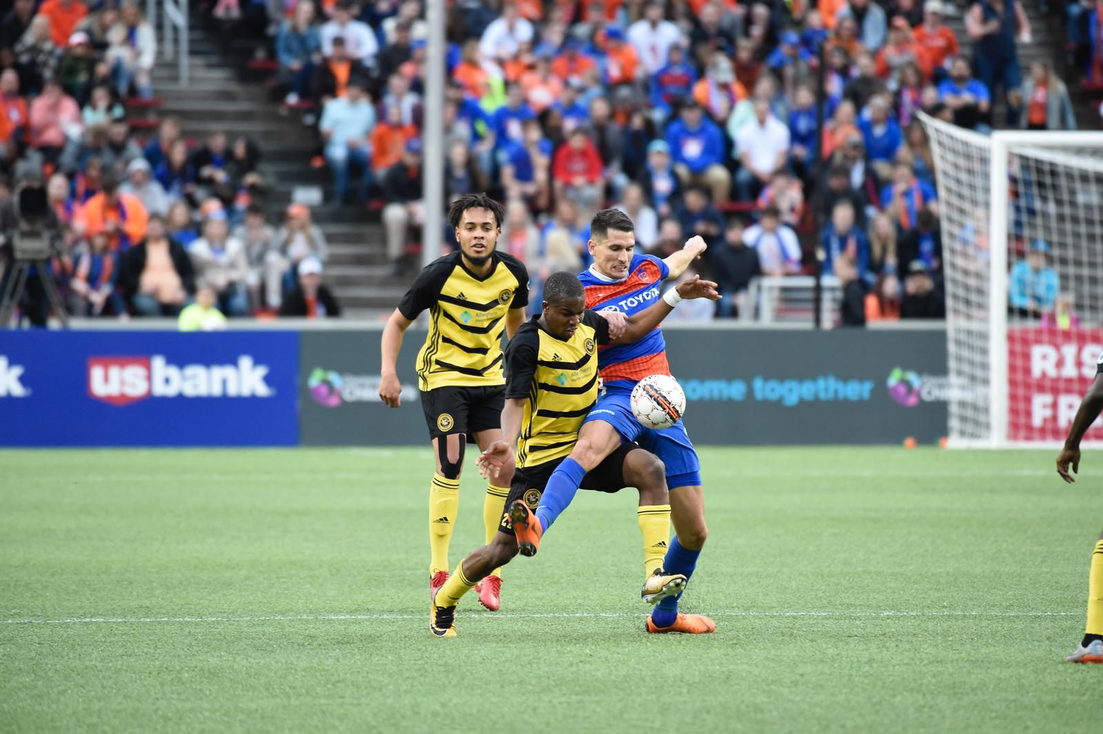 Mouhamed Dabo challenging for the ball during a professional soccer match.