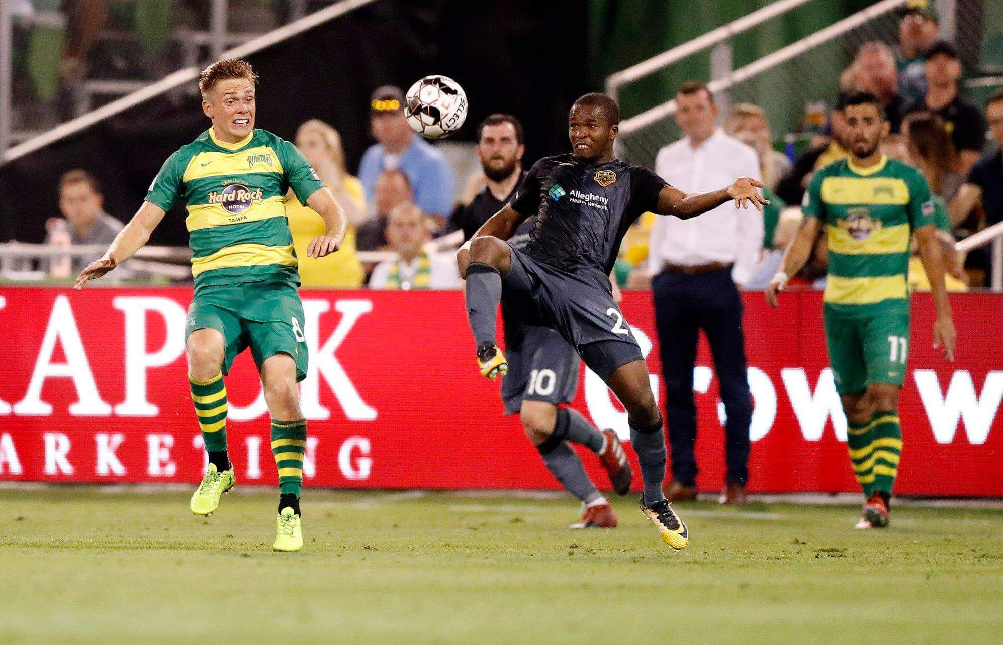 Mouhamed Dabo challenging for the ball during a professional soccer match.